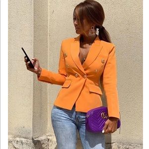 Orange blazer with gold buttons